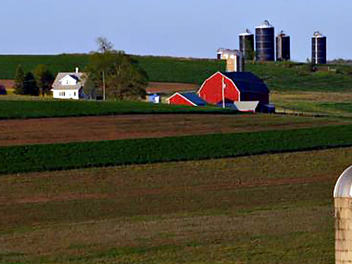 A Shenandoah Valley farm with a red barn and silos